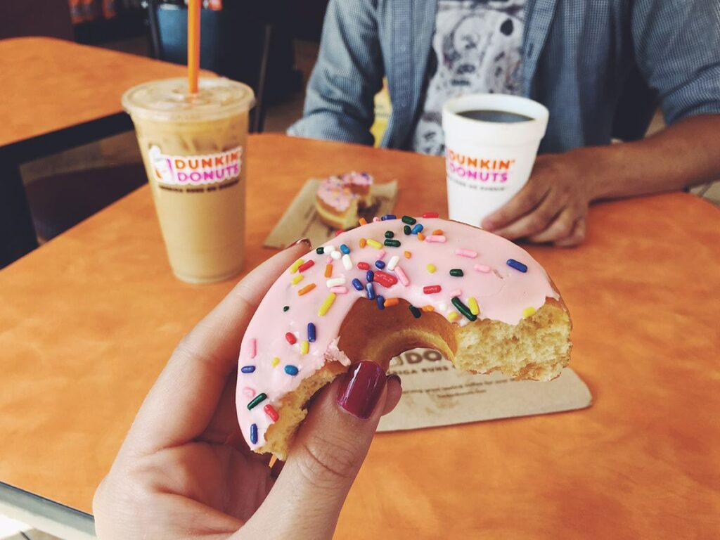 Dunkin strawberry frosted donut with sprinkles