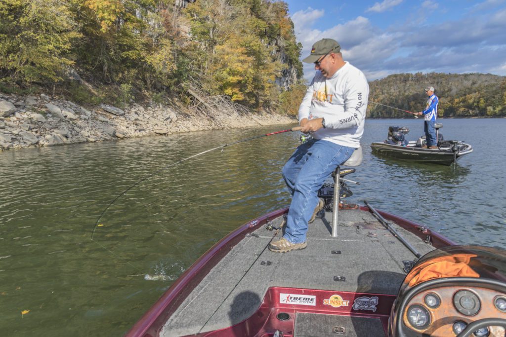 Two men fishing on separate fishing boats on Lake Cumberland