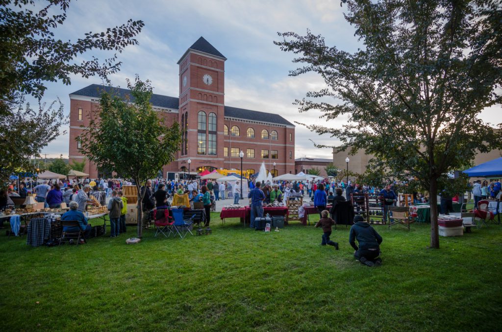 Festival vendors and people at the Judicial Center Plaza.