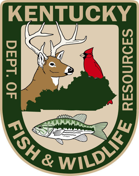 KY Department of Fish and Wildlife logo which is a badge with the words Kentucky Dept. of Fish and Wildlife Resources around the outside in a tan color with a green color in the back ground and in the middle the state of KY in green with a cardinal atthe top a buck to the the left and a fish on the bottom on a tan background