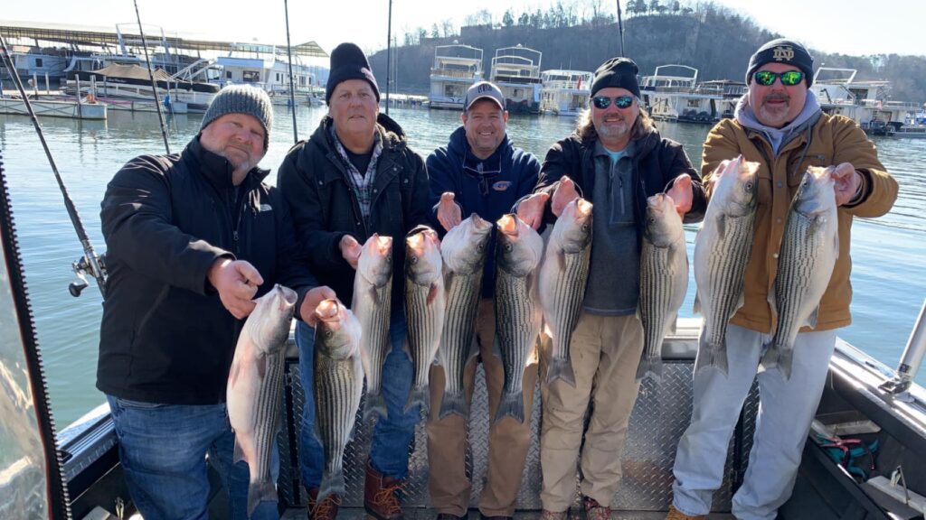 Group of guys holding their catch of the day