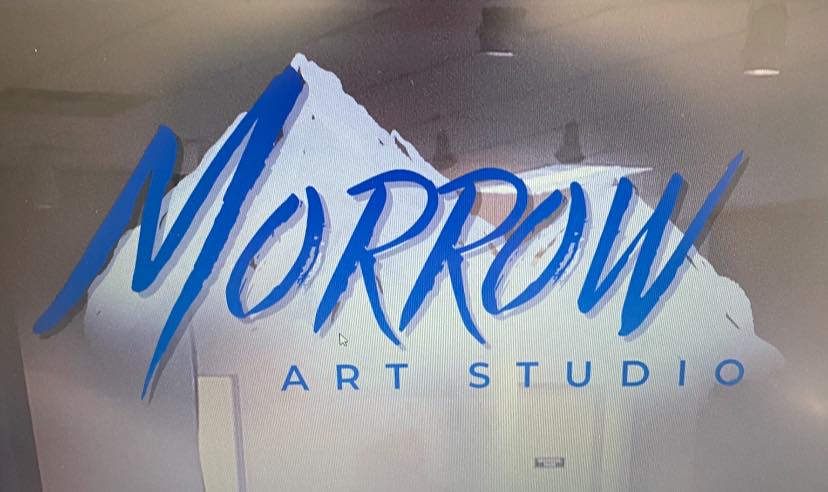 The words Morrow Art Studio in a blue color with a mountain lanscape in the back