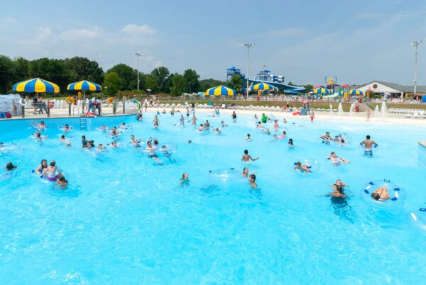People playing in large wave pool.