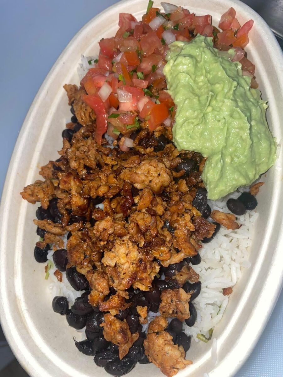 wildcat bowl which consists of beans, rice, chicken, Pico de Gallo, and guacamole.