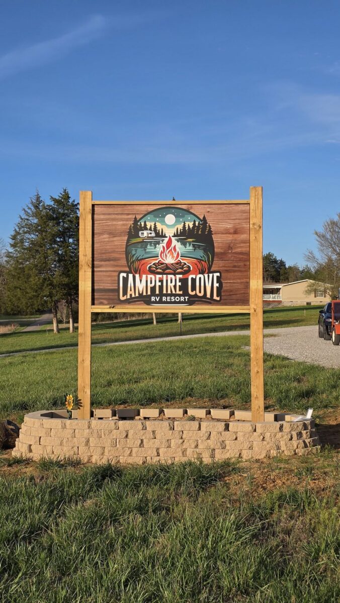 Wooden Sign that says Campfire Cove